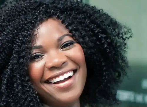 A woman smiling